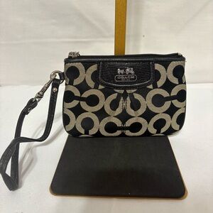 Coach Op Art Madison wristlet in black signature canvas, black leather trim.